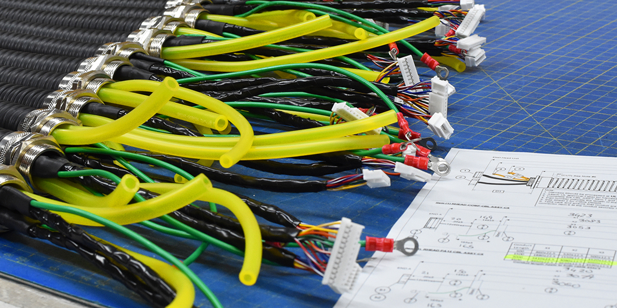 Custom cable looms in bespoke trunking.